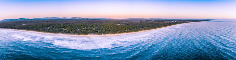 Wide aerial panorama of ocean coastline near Arrawarra, New South Wales, Australia