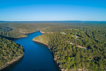 Fototapeta na wymiar Aerial view of Nepean Lake and forested hills with clear blue sky. Bargo, New South Wales, Australia