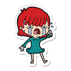 sticker of a cartoon girl crying