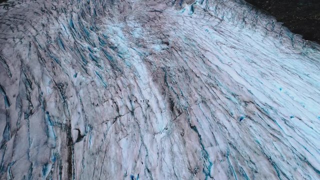 Elevate aerial of a blue iced glacier hike.