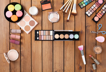 Makeup products on a wooden background