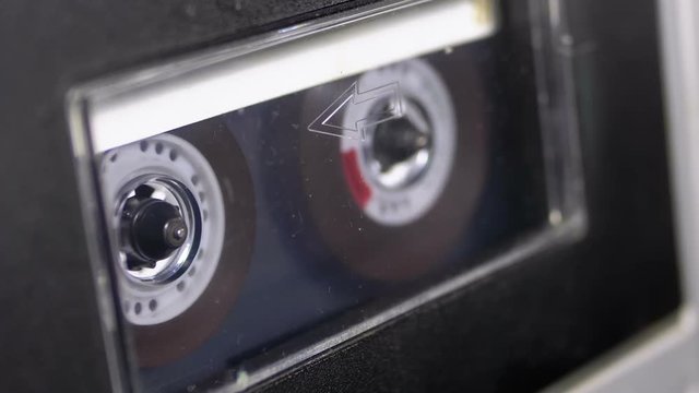 Audio Tape. Vintage Tape Recorder Plays Audio Cassette inserted therein