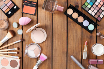 Makeup products on a wooden background