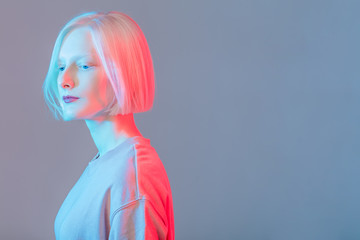 romantic serious girl with perfect skin looking down, close up side view photo, copy space,...