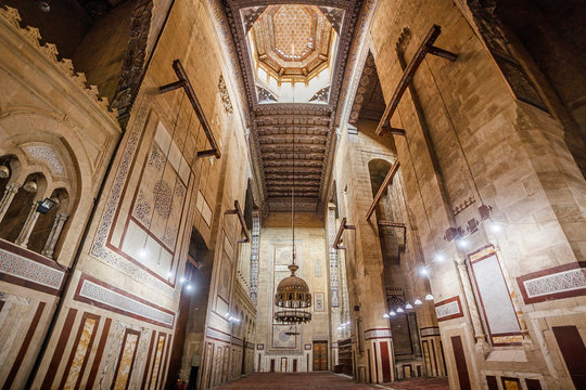 CAIRO, EGYPT Interior of Al-Refai Mosque with old decorated stone walls of bricks, colored marble decoration, wooden decorative ceiling, large brass chandeliers and wooden lattice doors, Cairo, Egypt