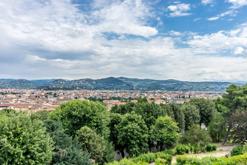 Italy,Florence, a large green field with trees in the background