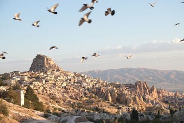 View of ancient Nevsehir cave town and a castle of Uchisar dug from a mountains in Cappadocia, Central Anatolia,Turkey