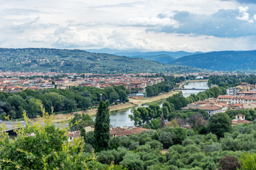 Fototapeta na wymiar Italy,Florence, a view of a city with a mountain in the background