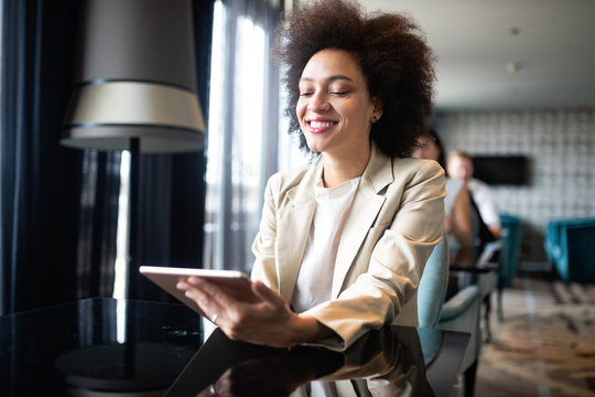 Portrait Of A Successful Business Woman Using Digital Tablet