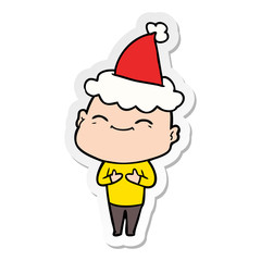 happy sticker cartoon of a bald man wearing santa hat