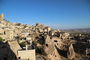 Obraz premium View of ancient Nevsehir cave town and a castle of Uchisar dug from a mountains in Cappadocia, Central Anatolia,Turkey