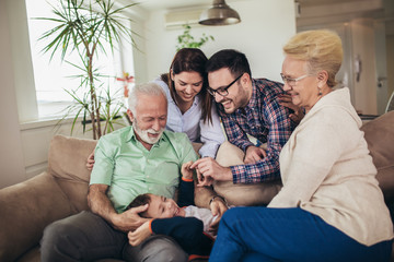 Portrait of a three generation family spending time together at home.