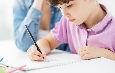 Mother and child drawing together