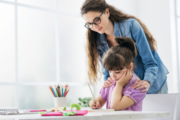 Mother and child doing homework together