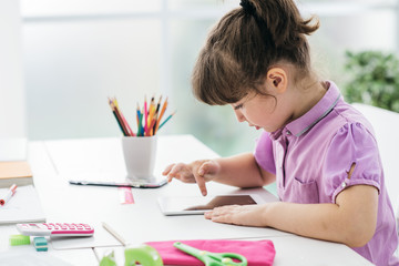 Cute girl using a digital tablet