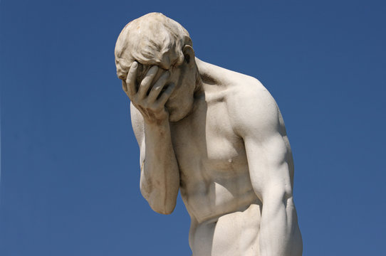 Facepalm statue in Paris - despair, headache, depression