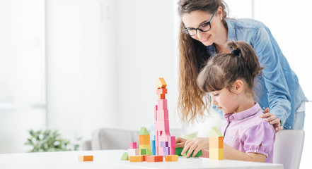 Mother and daughter playing together