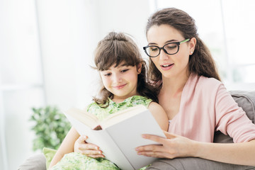 Mother and daughter reading together