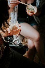 Two women drinking wine and eating