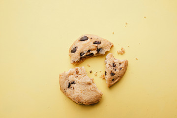 pieces of broken cookie, close up. crumbles, diet, part, sharing concept. minimal confectionery design