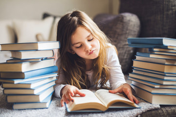 Little girl reading book