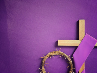 Good Friday, Lent Season and Holy Week concept - A religious cross and a woven crown of thorns on...