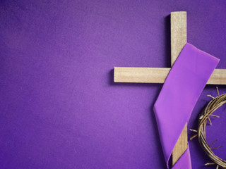 Good Friday, Lent Season and Holy Week concept - A religious cross and a woven crown of thorns on...