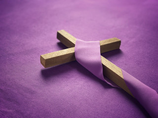 Good Friday, Lent Season and Holy Week concept - A religious cross on purple background.