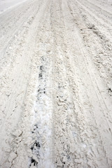 Traces of tires on a snowy road