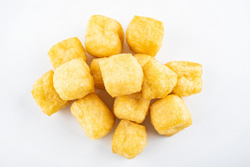 Golden oil tofu on white background