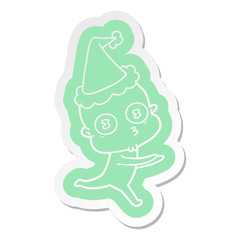 cartoon  sticker of a weird bald spaceman running wearing santa hat