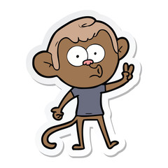 sticker of a cartoon hooting monkey