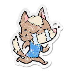 distressed sticker of a cartoon crying wolf running away