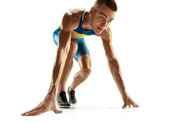 Young caucasian man preparing to run isolated on white studio background. One male runner or jogger. Silhouette of jogging athlete with shadows.