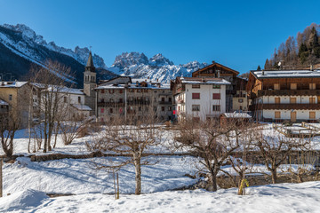 Fototapeta na wymiar Forni di Sopra winter. Ancient mountain village. Pearl of the Friulian Dolomites