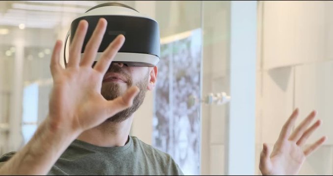Man using virtual reality headset indoors 4k