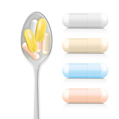Vitamin supplements on spoon
