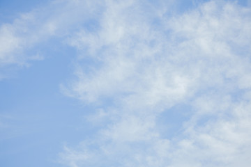 Blue sky with white clouds. Beautiful sky background. Clear day and good weather