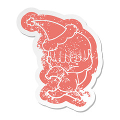 cartoon distressed sticker of a boy with untidy hair wearing santa hat
