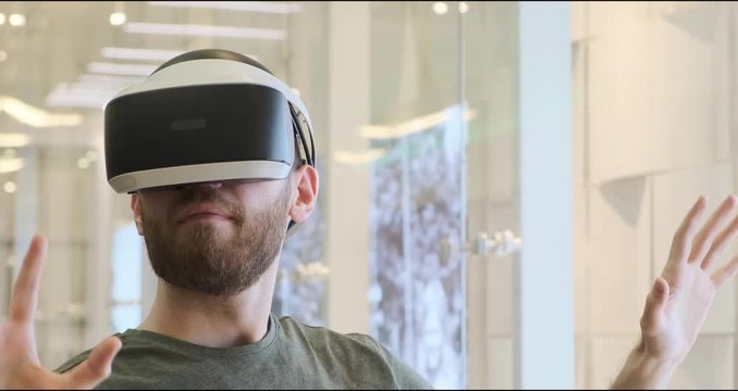 Man using virtual reality headset indoors 4k