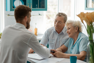 Seniour couple meeting an advisor