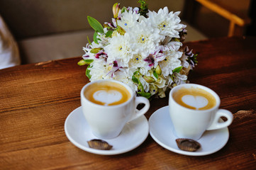 Obraz na płótnie Canvas Wedding bouquet with a cup of coffee