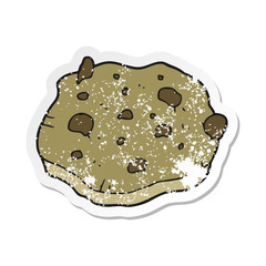 retro distressed sticker of a cartoon chocolate chip cookie