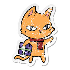 distressed sticker of a cartoon cat with gift