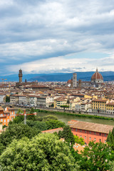 Fototapeta na wymiar Panaromic view of Florence townscape cityscape viewed from Piazzale Michelangelo (Michelangelo Square) with ponte Vecchio and Palazzo Vecchio with lightningPanaromic view of Florence townscape citysca