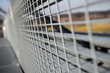 Metal lattice with small cells grid stock background with shallow  and selective focus