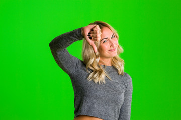 You are outsider. Studio shot of annoyed good-looking woman, feeling cool and confident while...