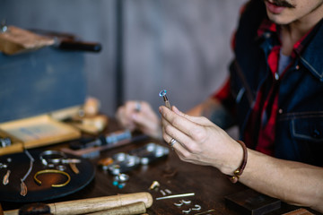 professional artisan dealing with material, close up cropped photo. business