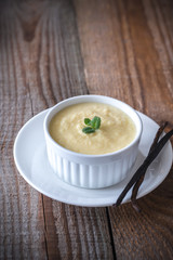 Custard on the wooden background