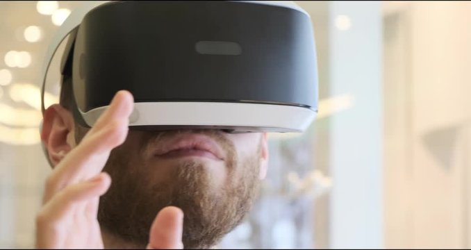 Man using virtual reality headset indoors 4k, close-up